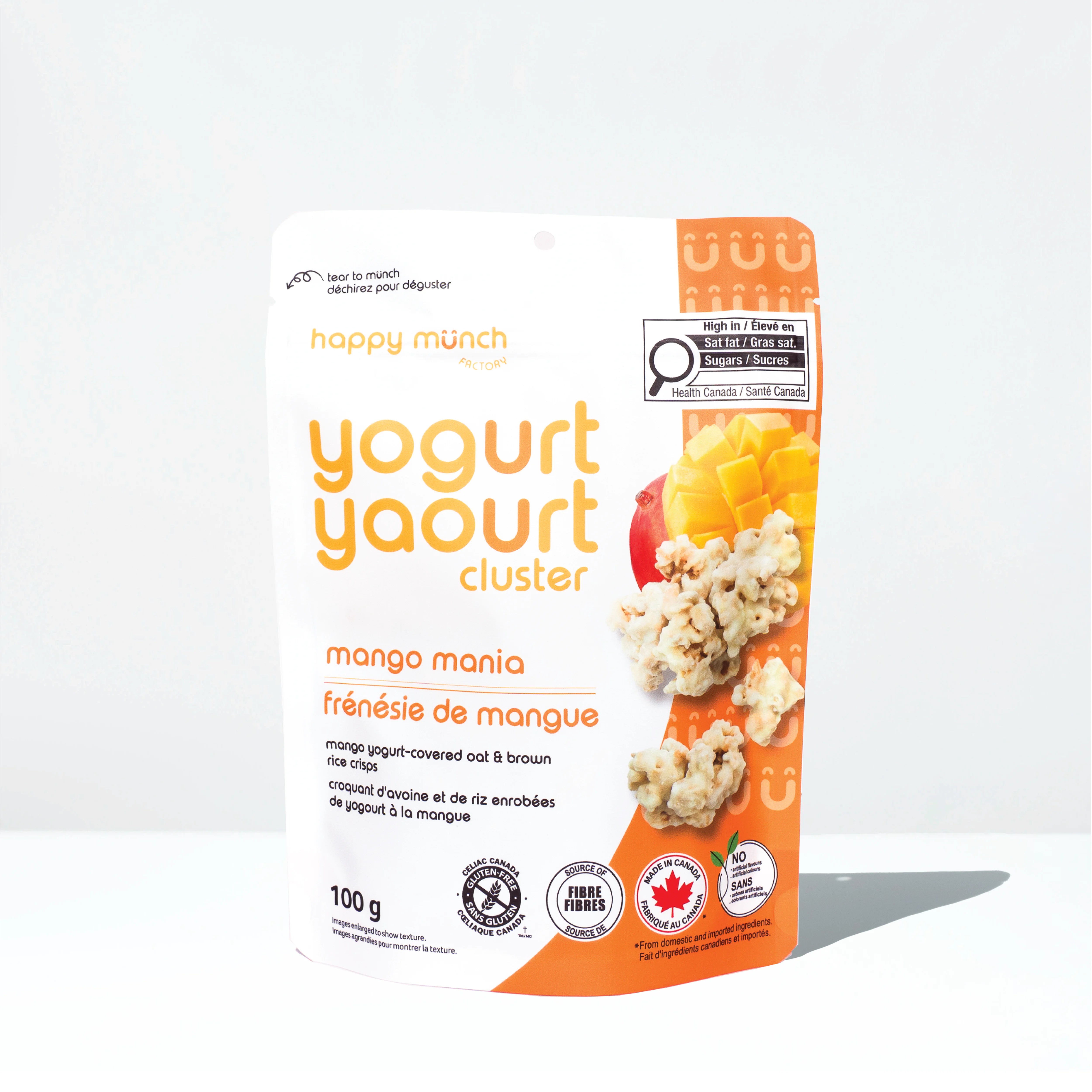 Front of Happy Munch Mango Mania yogurt cluster packaging on a white background